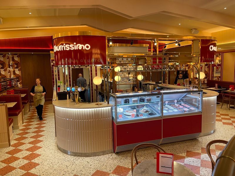 Di maggios Food bar with kitkat tile and terrazzo effect chequerboard tiles on the floor