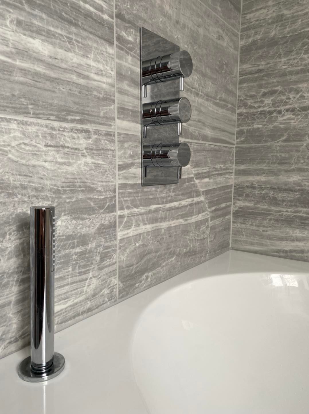 Grey wall tiles close up in a bathroom