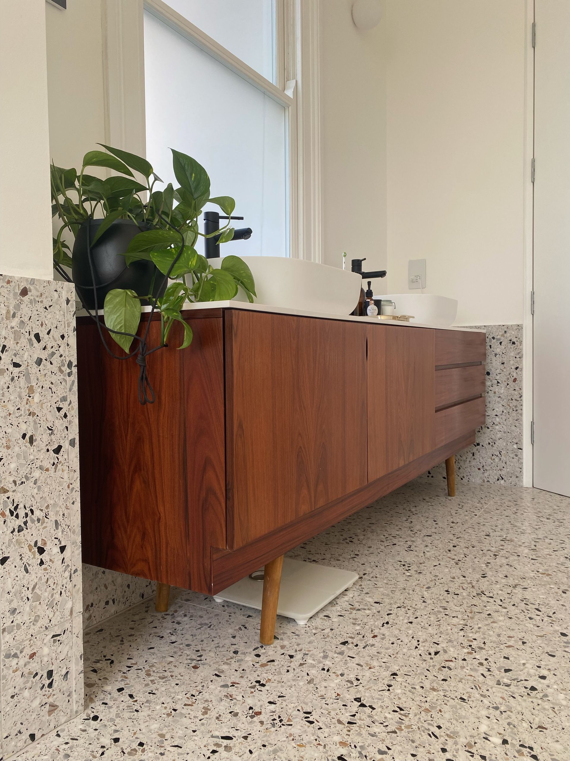 close up of terrazzo tile and sink drawers