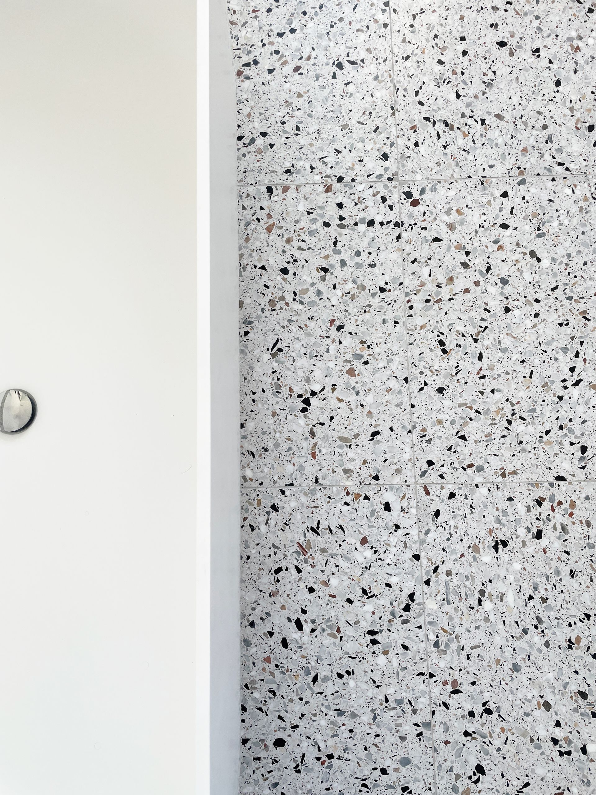large size real terrazzo tile , white rectangular sink with amazing contrast.