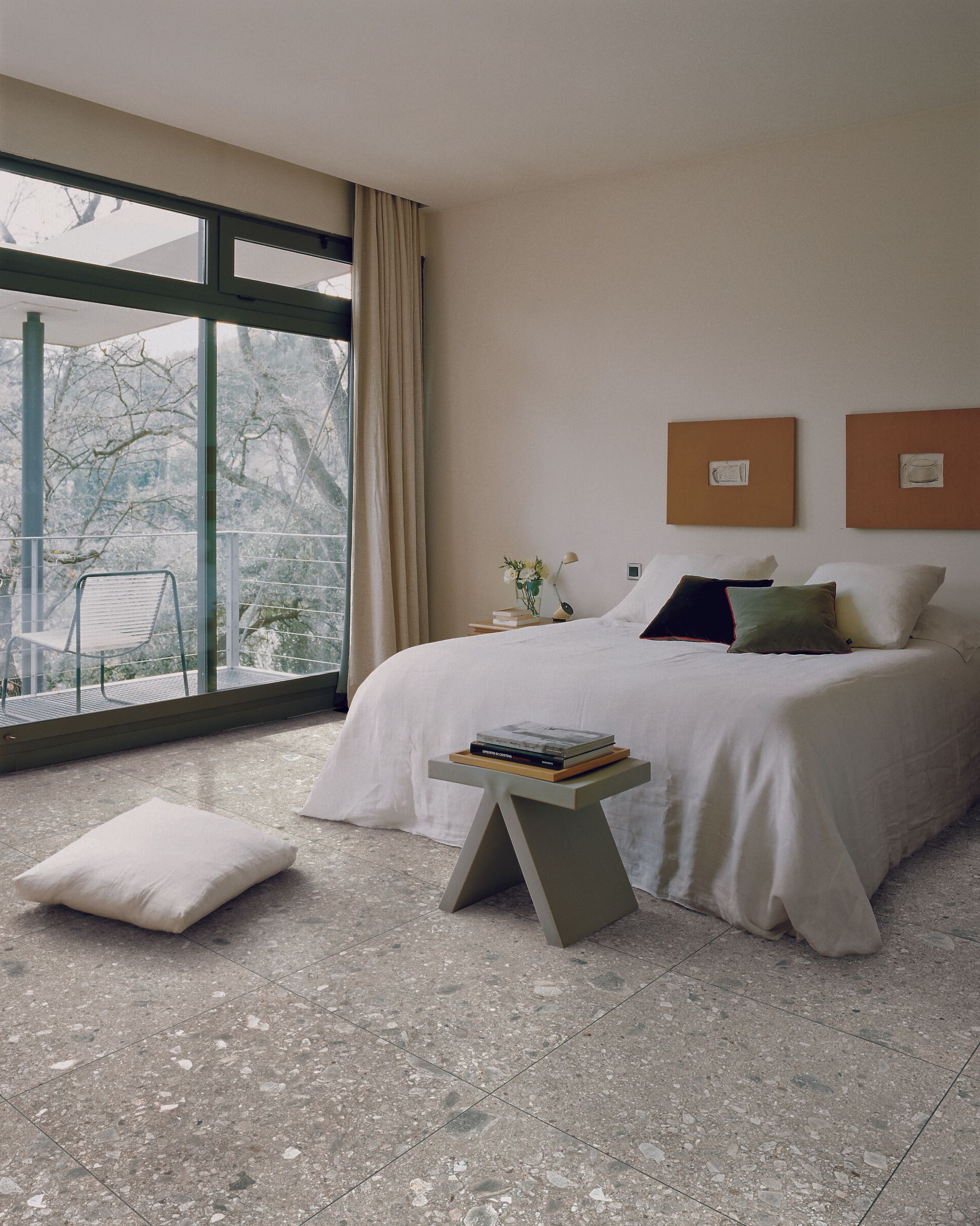terrazzo tiles in a minimalistic bedroom, white bed