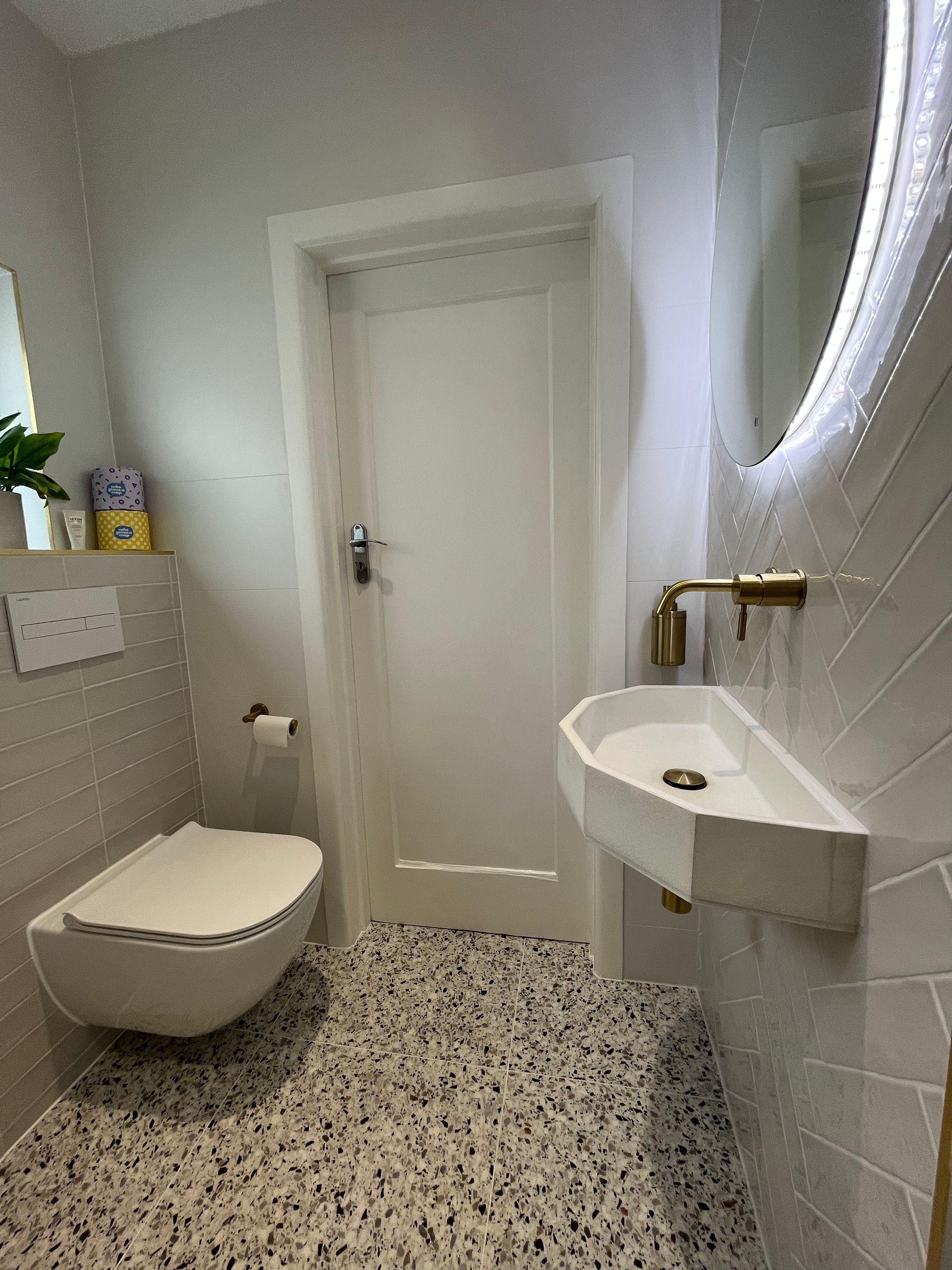 the door of a bathroom and a sink