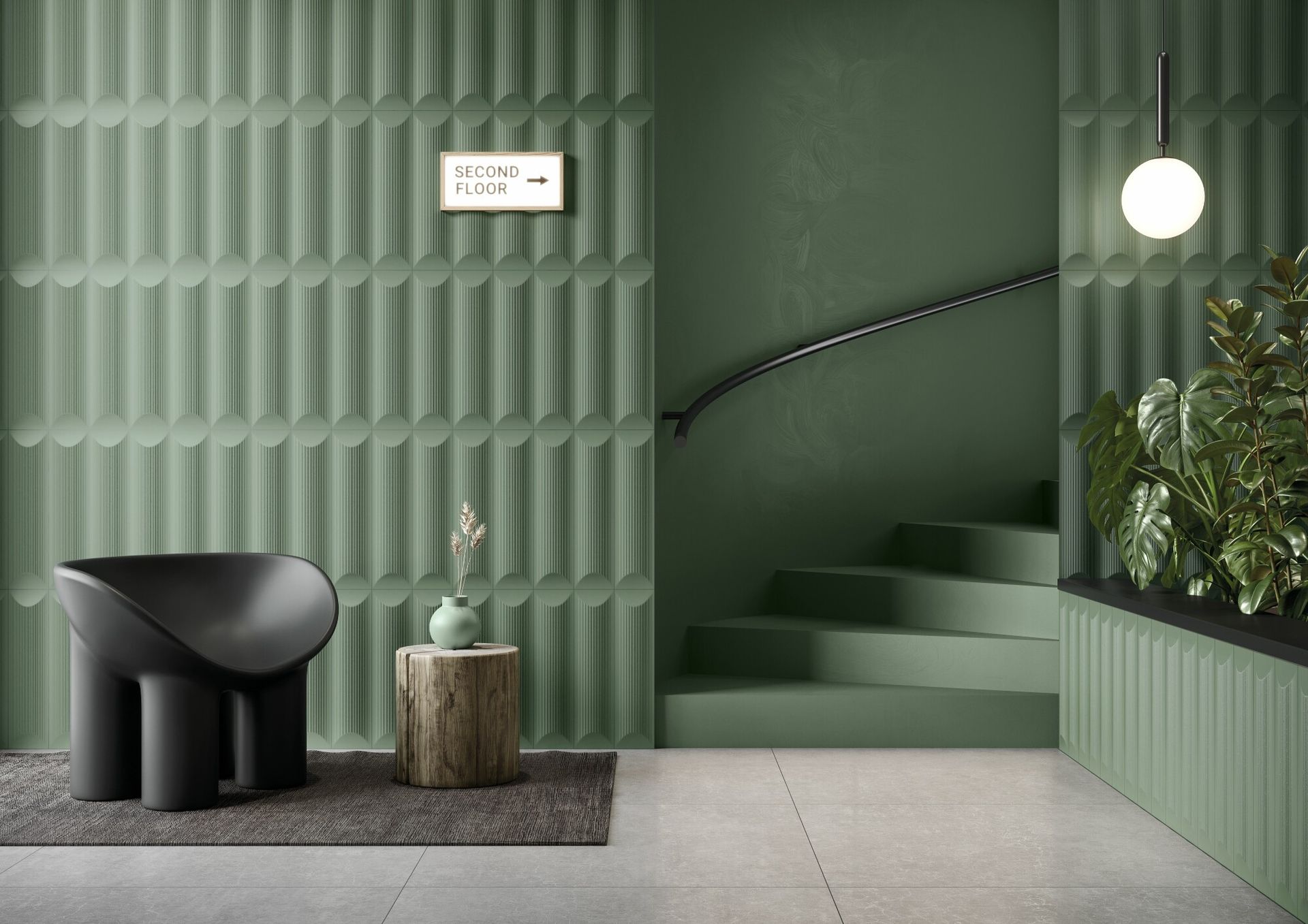 a green fluted tile feature with also a green planter with some large house plants and some green colour matched stairs and also a black oval chair for the waiting area.