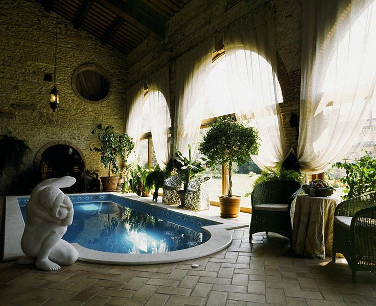 Outdoor pool with Coverage and trees and terracotta tiles