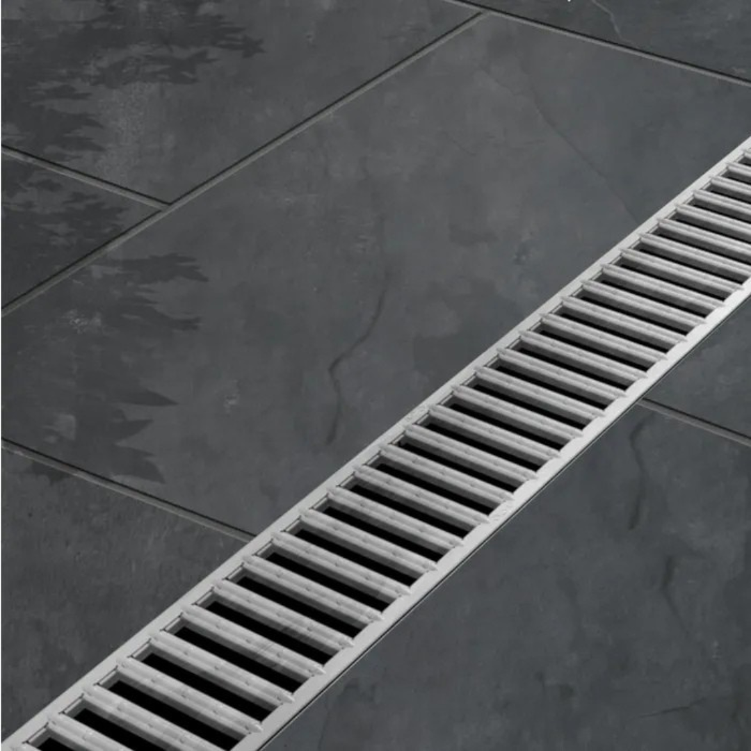 Close up of outdoor large format tiles and a drainage system