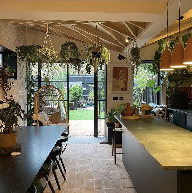 natural terracotta tiles , kitchen design , dark wood dining table