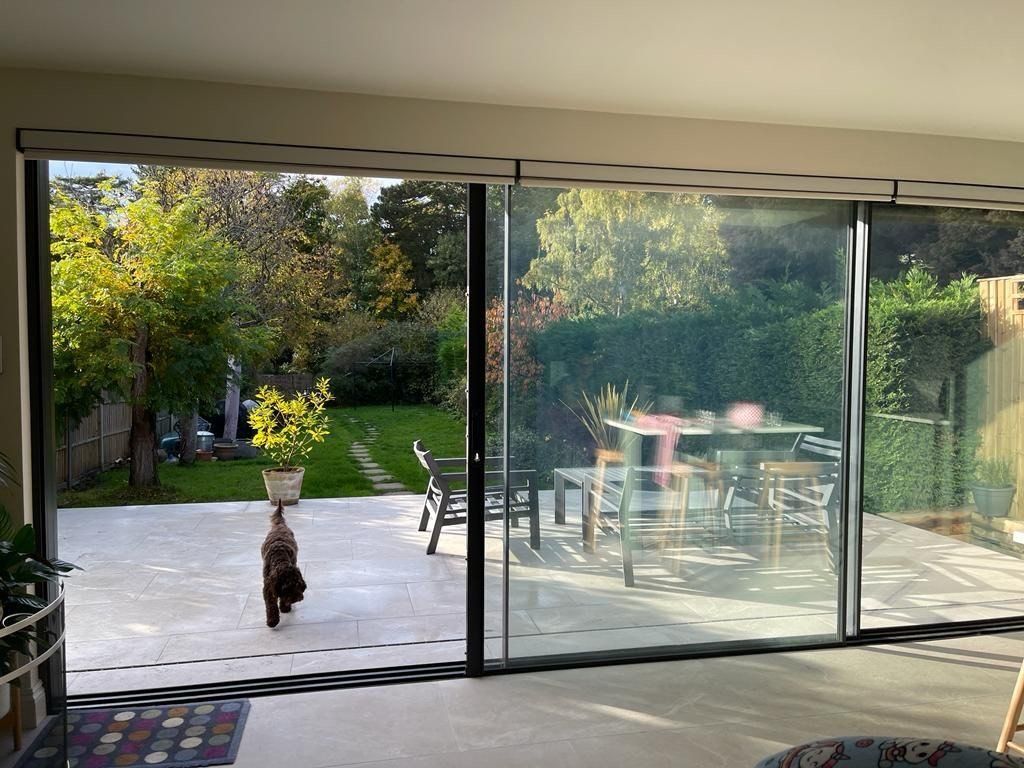 patio tiles, bookshelf , pool , black coffee table