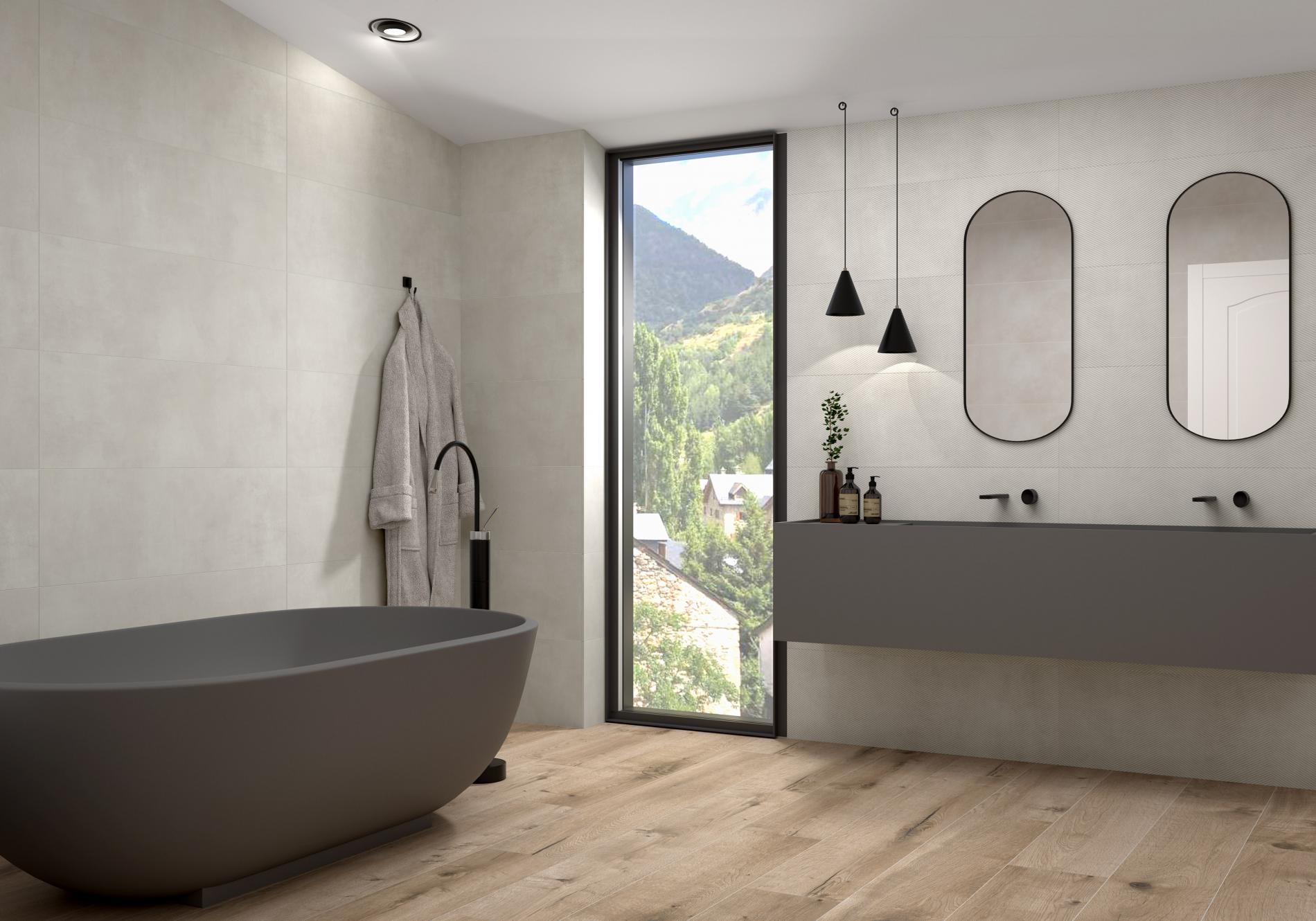 grey ceramic bath with grey sinks and wood effect floor tile in the bathroom