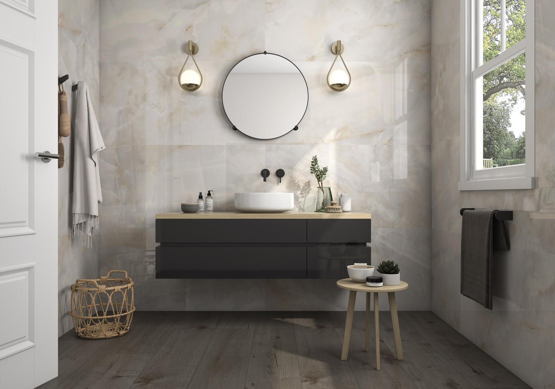 bathroom with brown barnwood flooring and marble feature wall