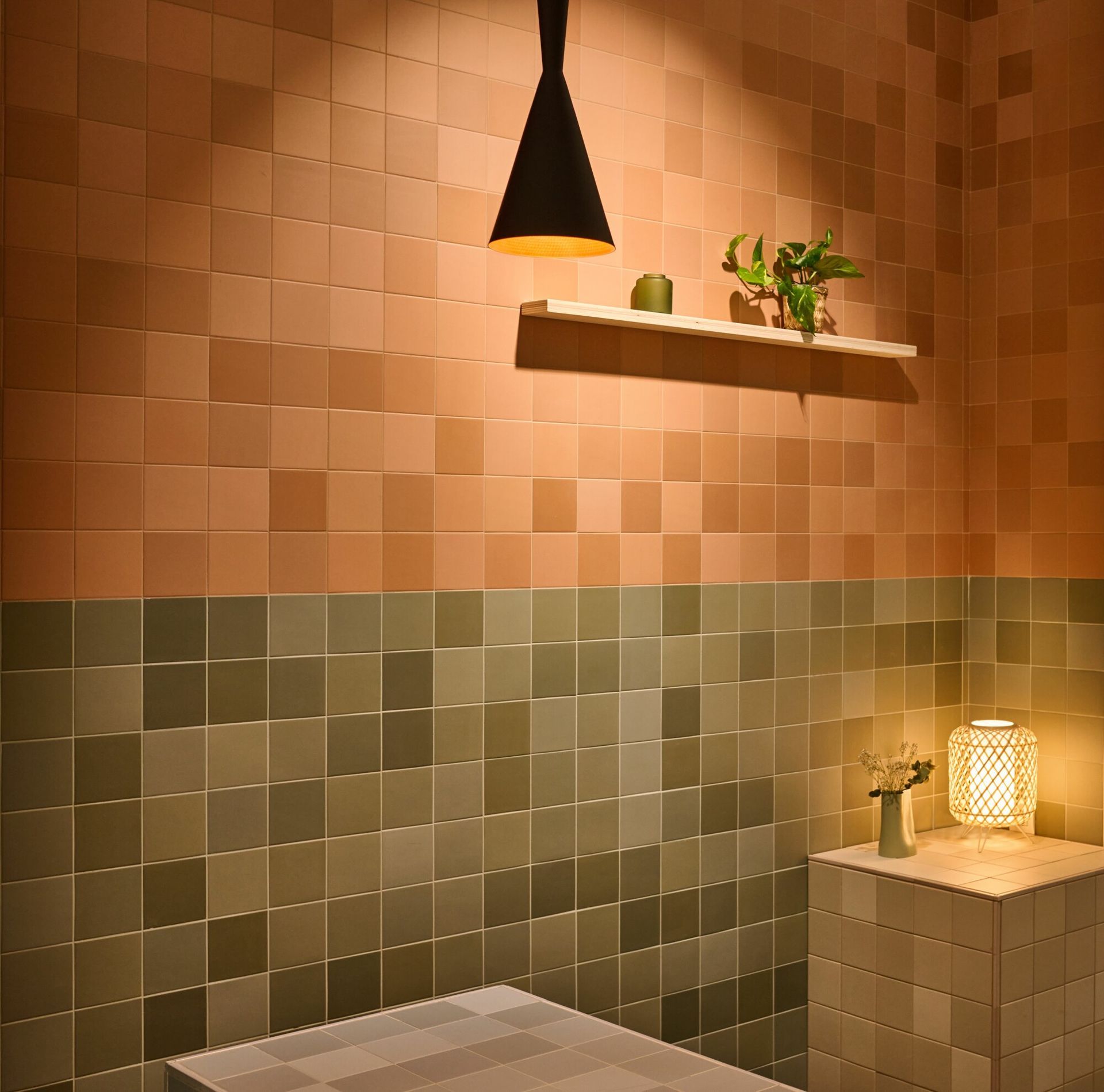 pink and green wall tiles , minimalistic aesthetic with a triangular lamp