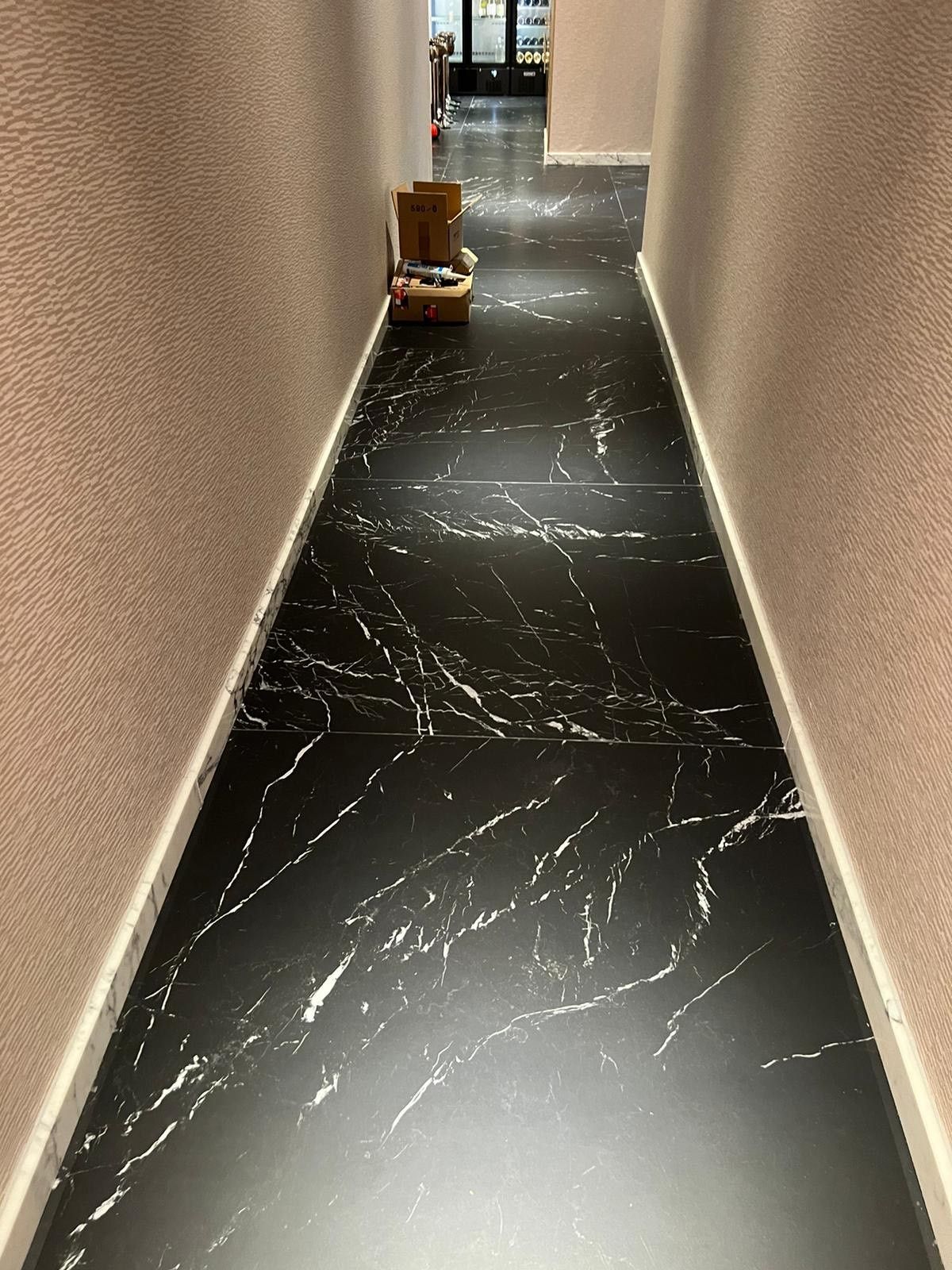Black marble flooring in the mayfair casino hallway