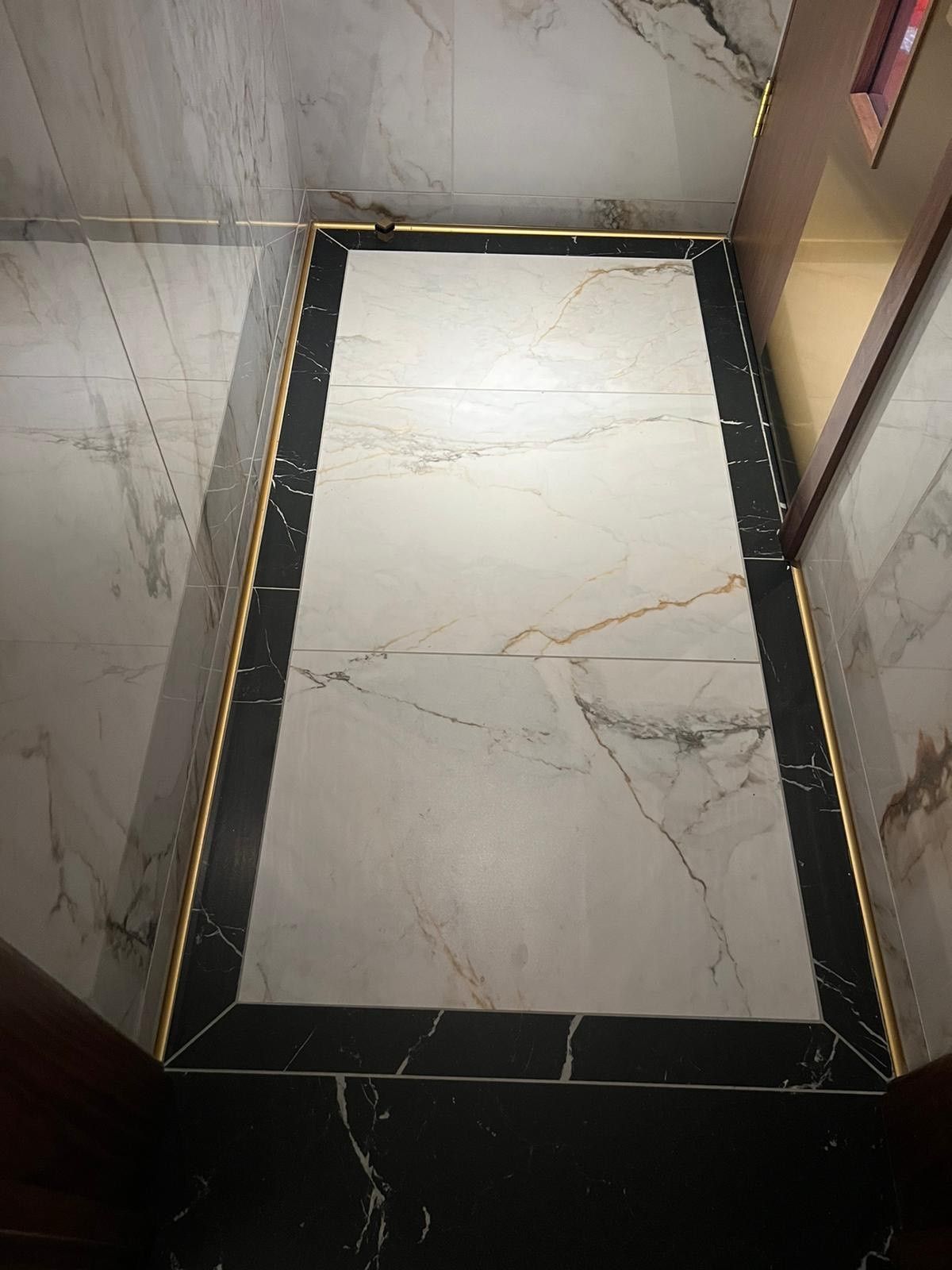 hallway in mayfair casino with marble white and black flooring