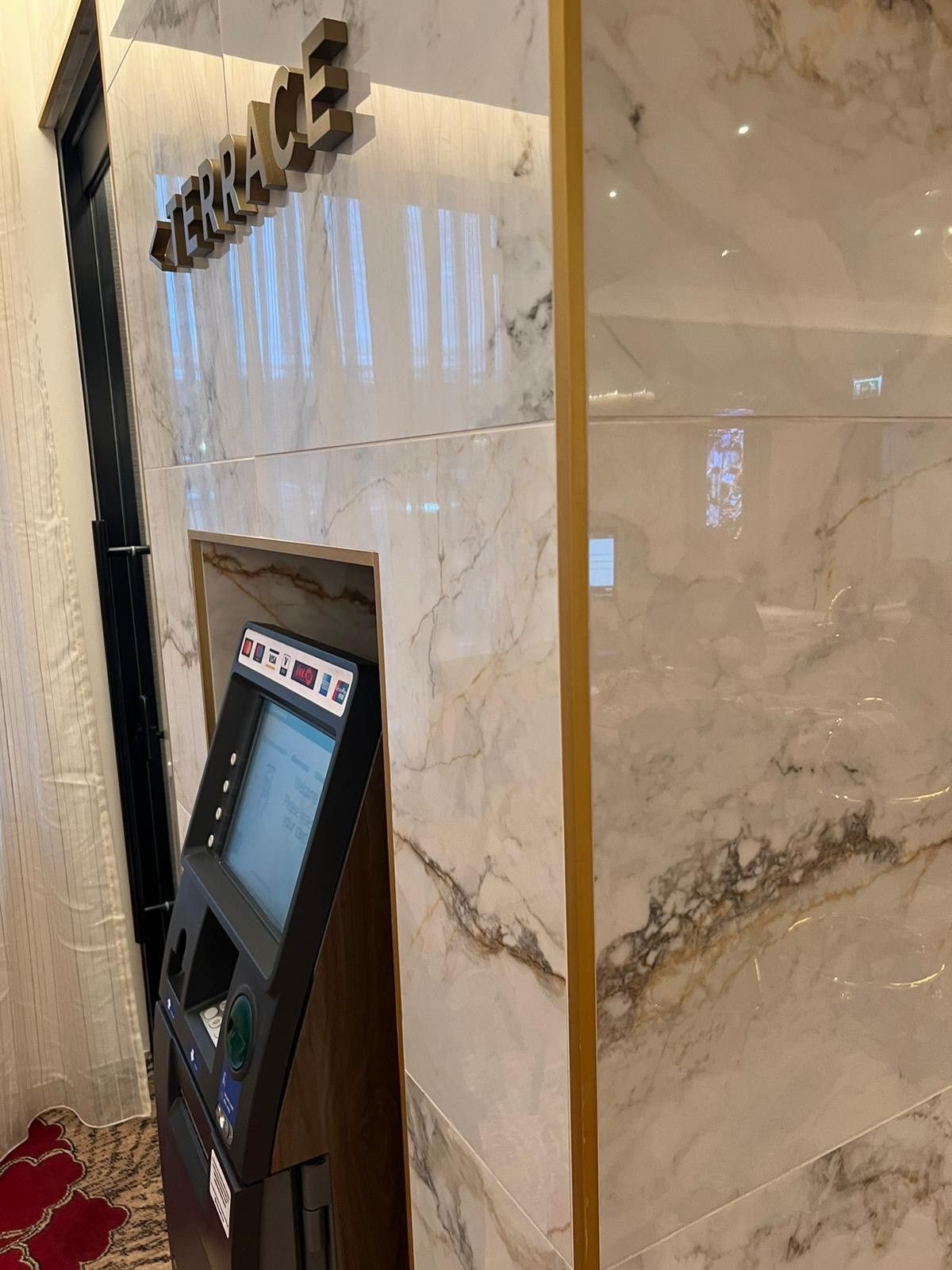 atm in the mayfair casino built into the marble wall