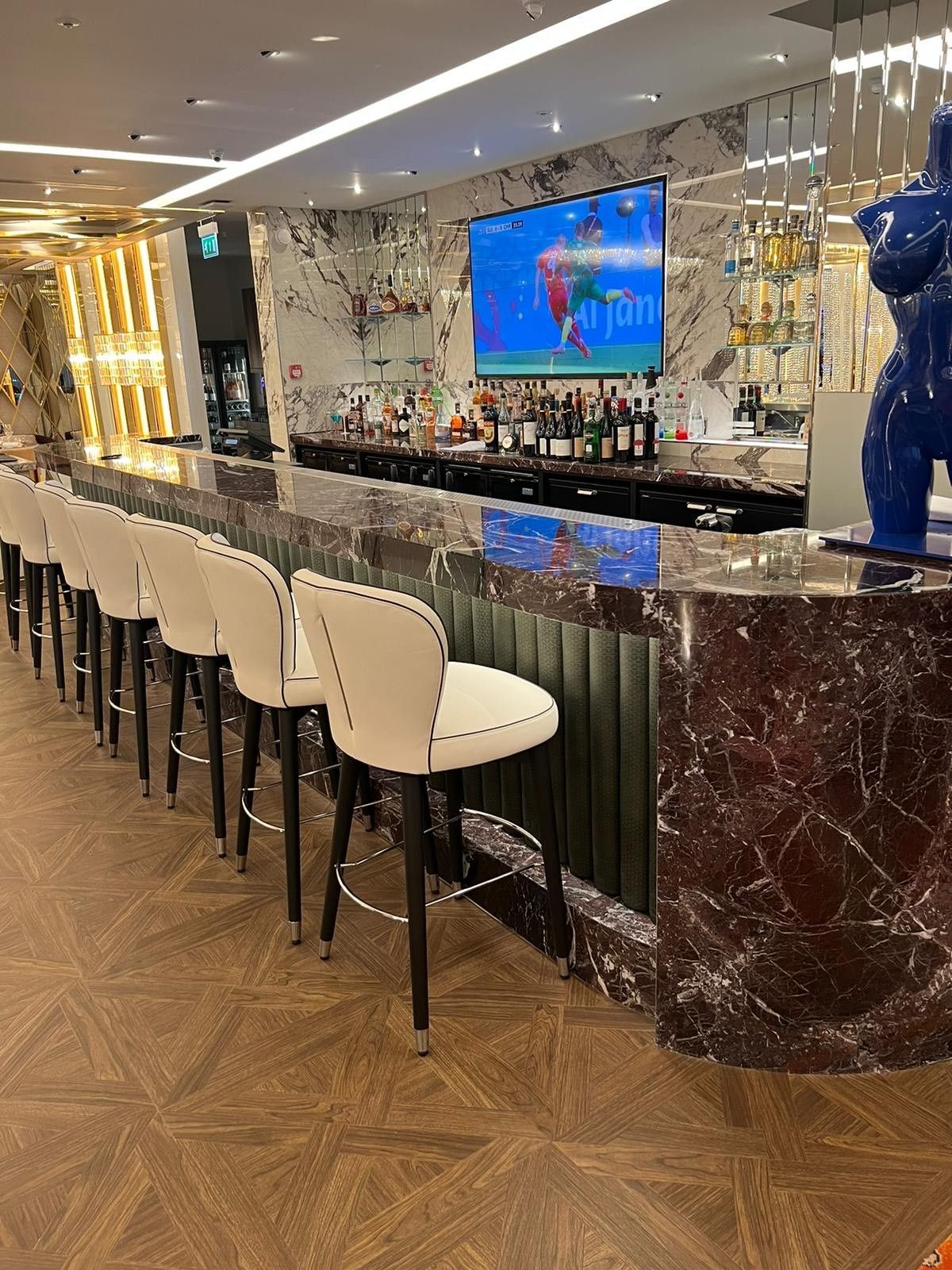Bar in the mayfair casino with fluted tiles and marble black