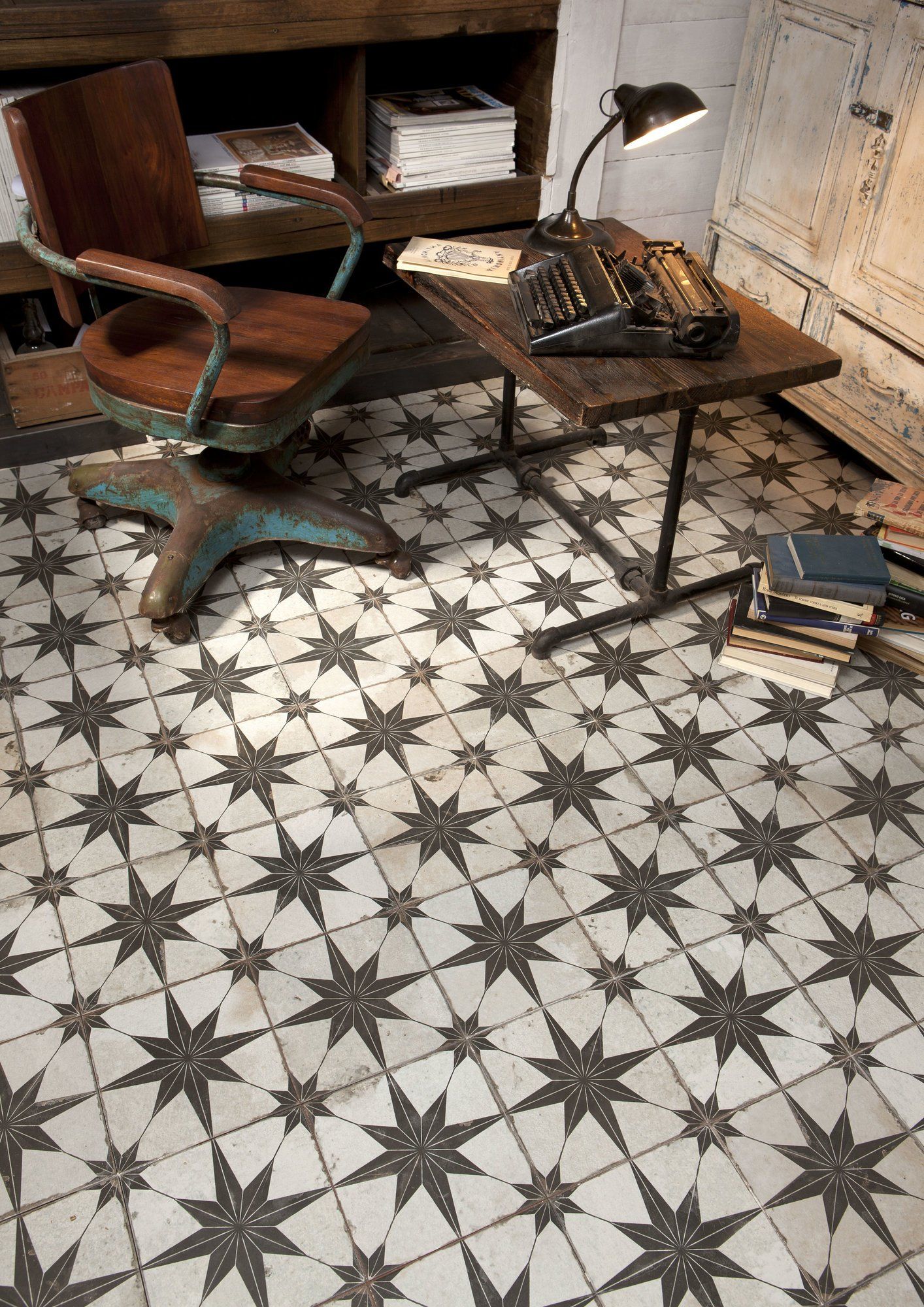pattern floor tiles, vintage office, typewriter, pile of books ,