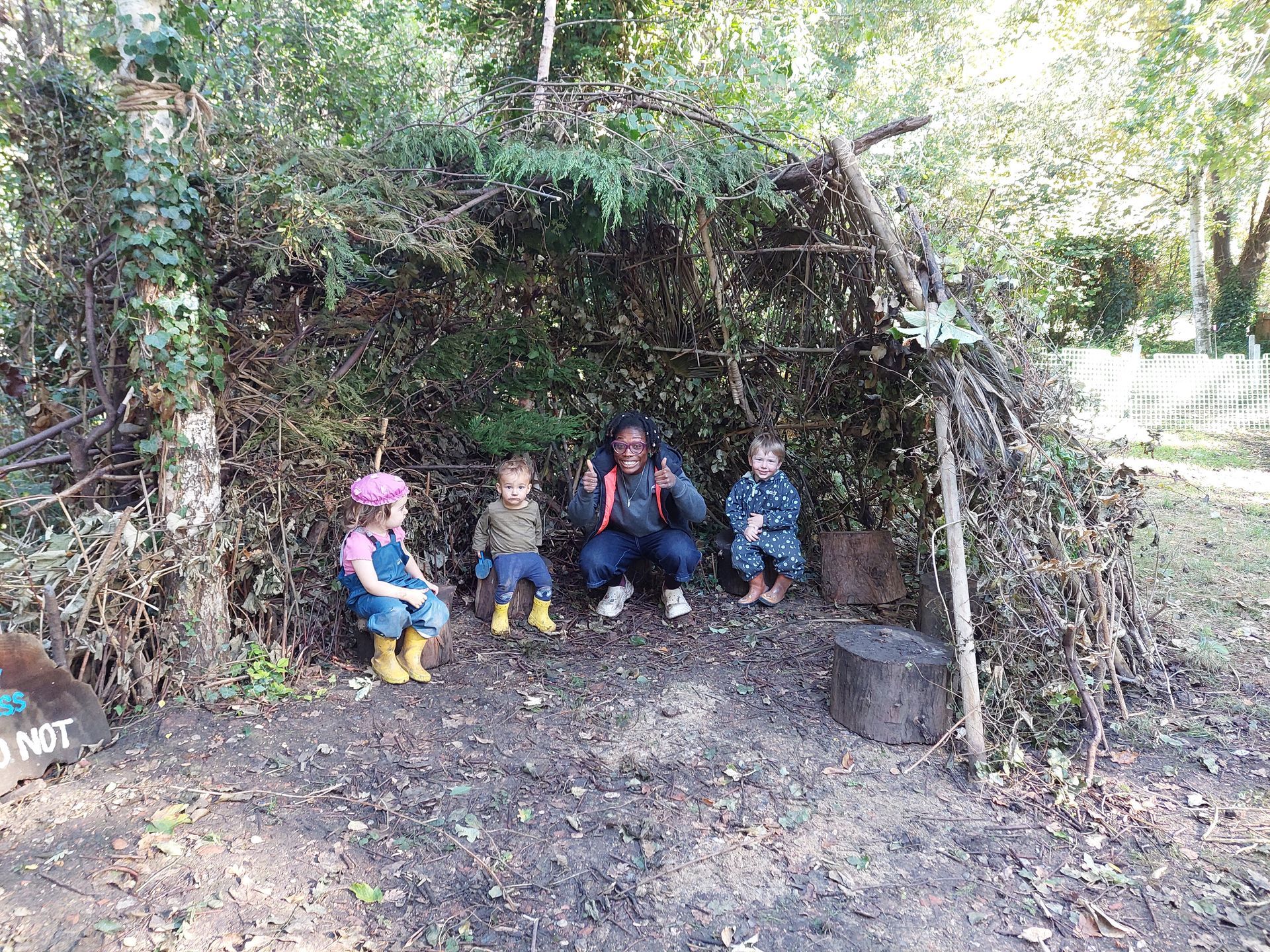 kids showing off their den building skills