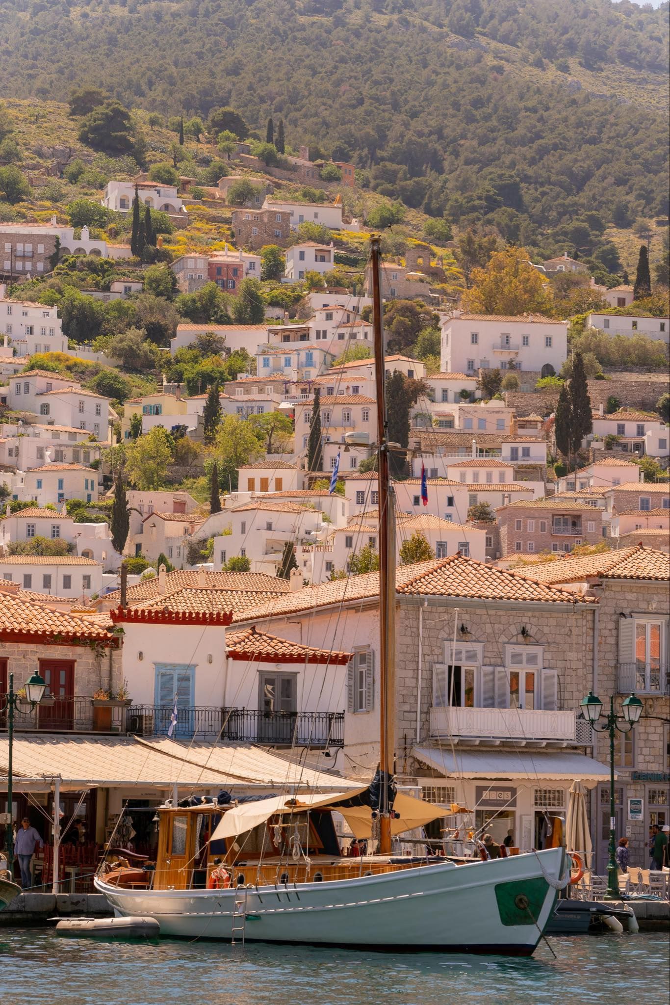 Calypso traditional Greek sailing boat in harbour on Hydra Island Greece