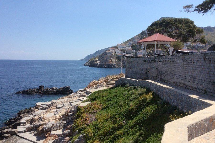 Spilia rocks and platforms below the Sunset Restaurant Bathing rocks and platforms below the Sunset Restaurant on Hydra Island Greece.