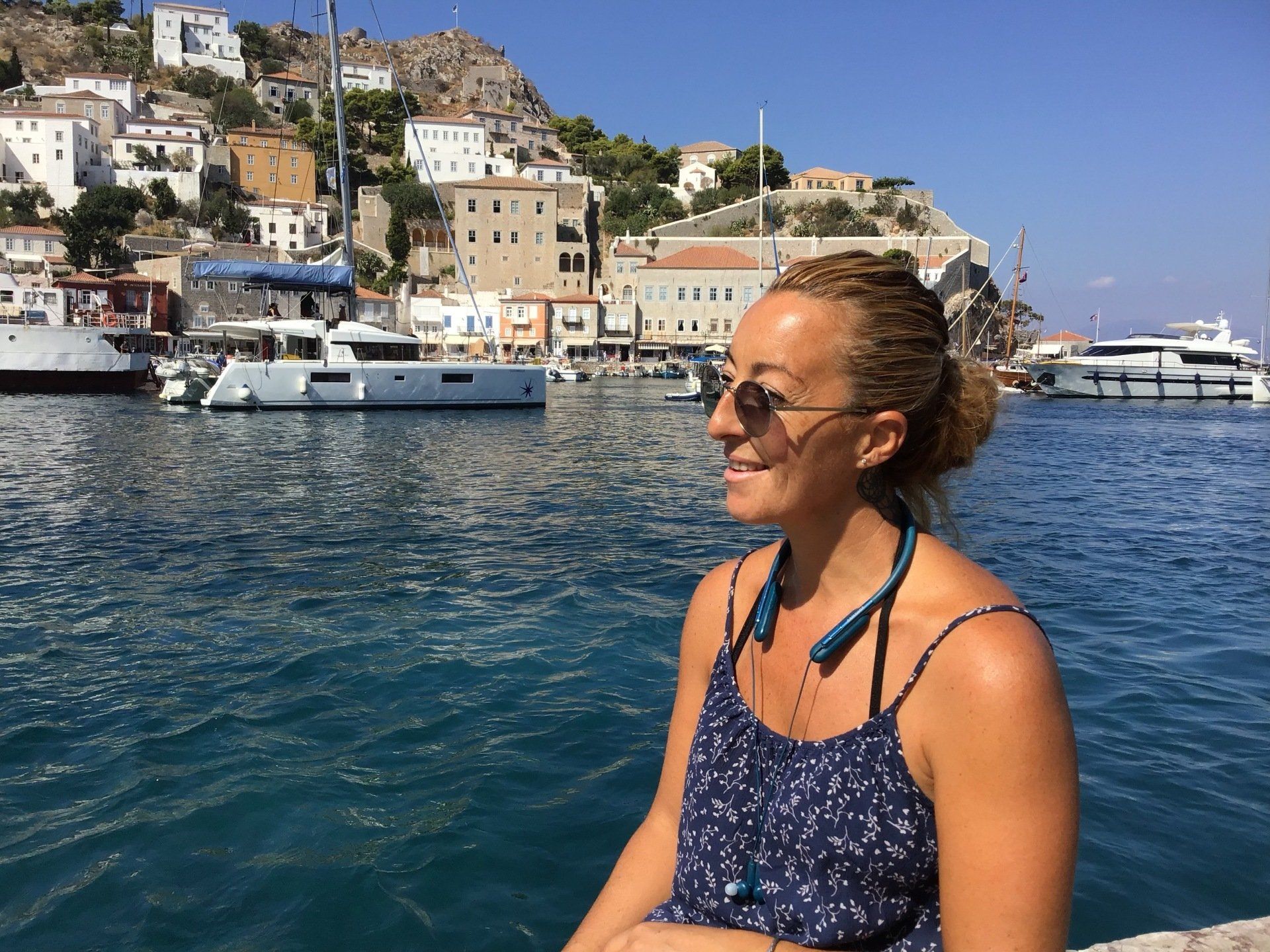 Marina Lazou with her sea taxi for Hydra on board the Eleni Sea Taxi on Hydra Island Greece for all your travel requirements.