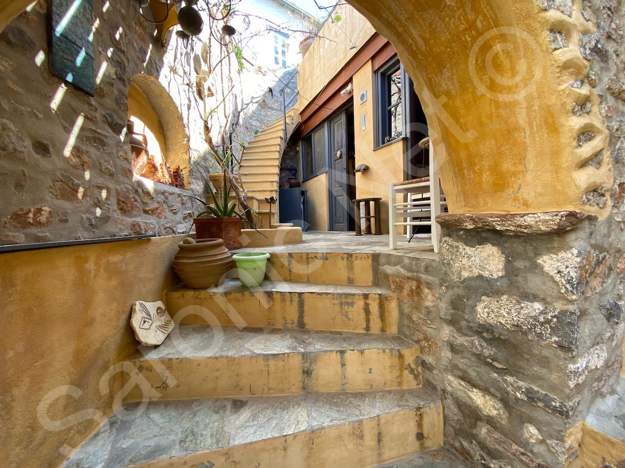 fully renovated with character and charm, this is a large semi detached house for sale on hydra island greece