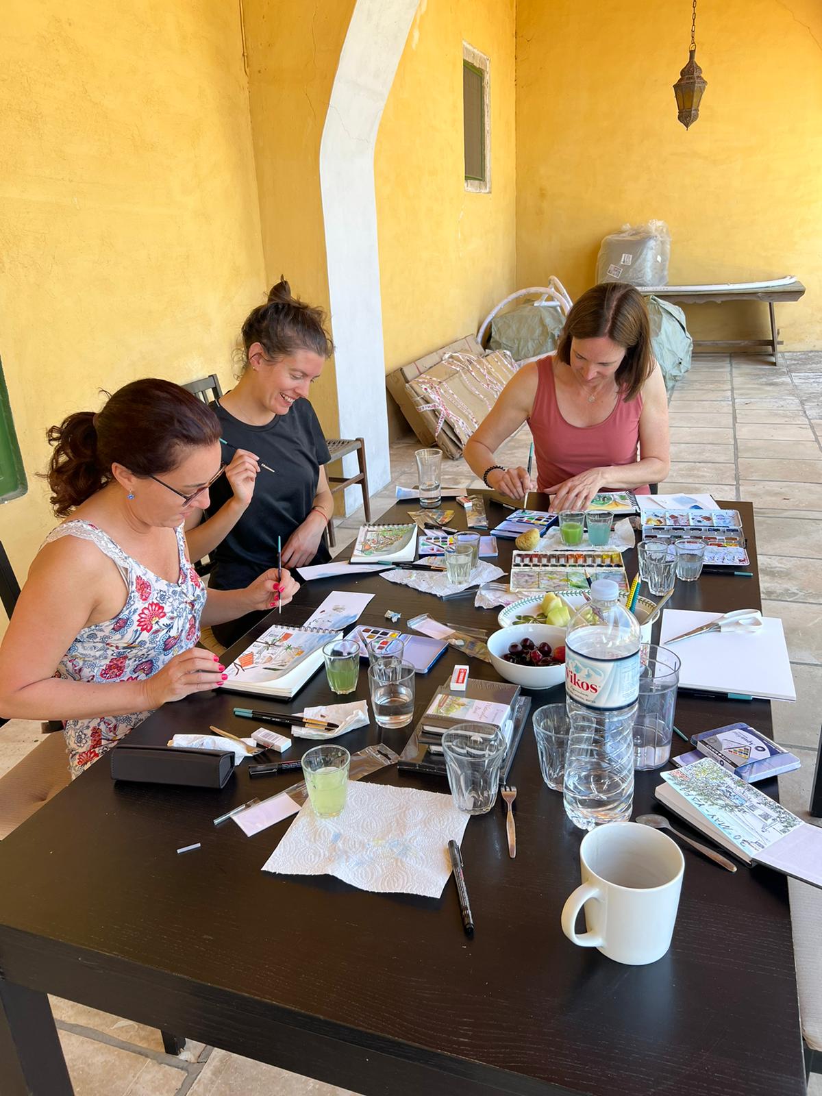 Students working with watercolour during art courses on Hydra Island Greece