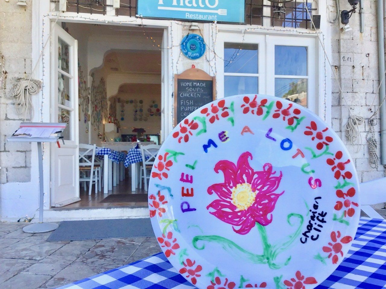 Author Polly Samson's plate commemorating the life and loves of Charmian Clift on Hydra Island Greece in her book A Theatre For Dreamers..