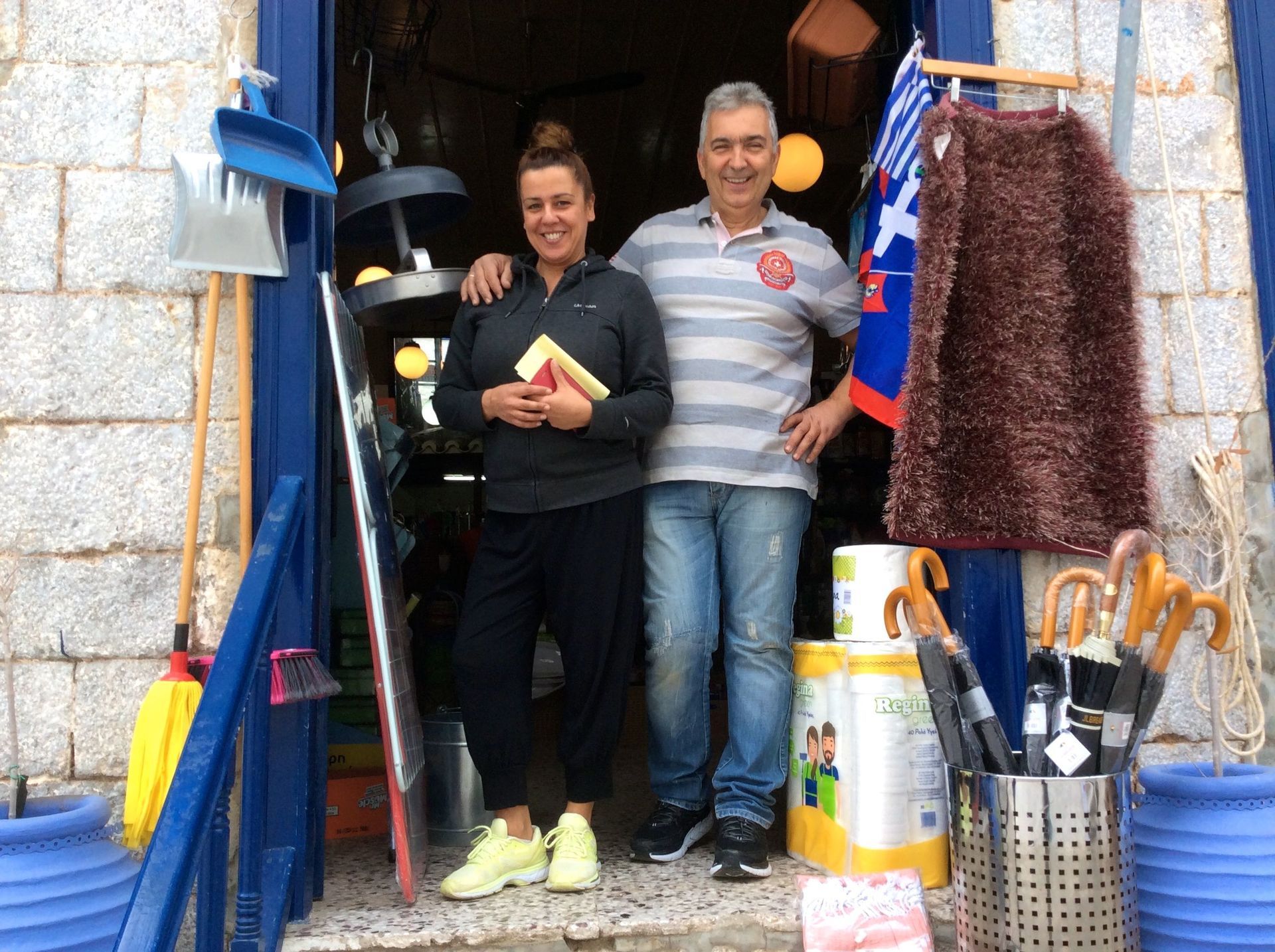 Plastic man's shop on Hydra has moved to a temporary vacant shop which weather damage is repaired.