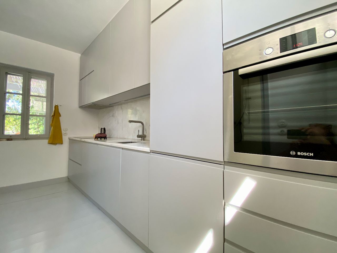 Galley kitchen with built-in appliances