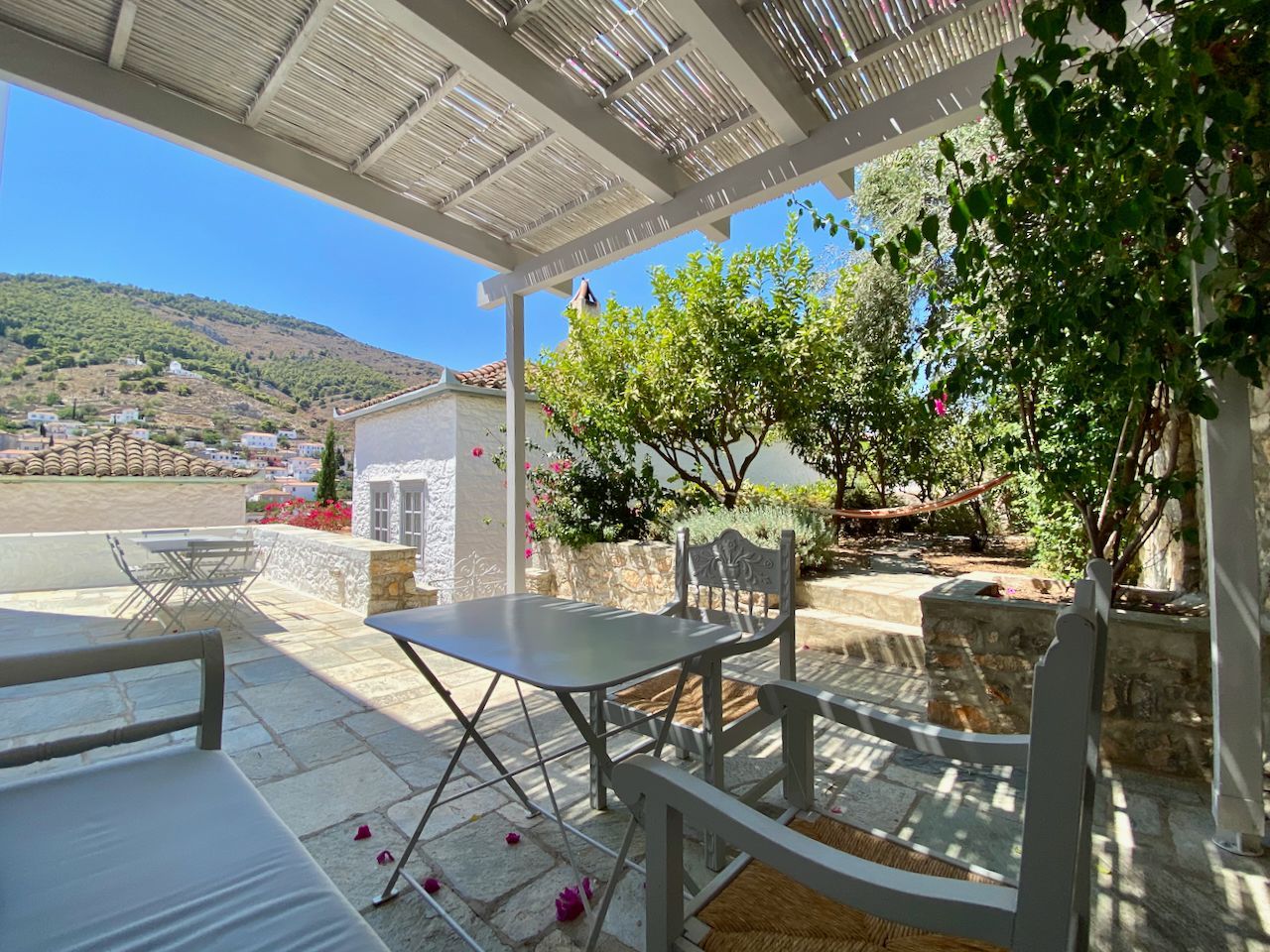 Main dining terrace of 2 bedroom holiday house rental on Hydra Island Greece