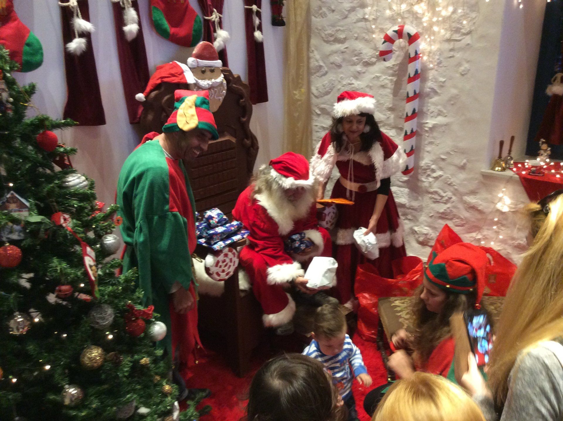 Cheif Elf, Sotiris Iliadis and Mother Christmas, Angeliki Stroumbouli helping Father Christmas
