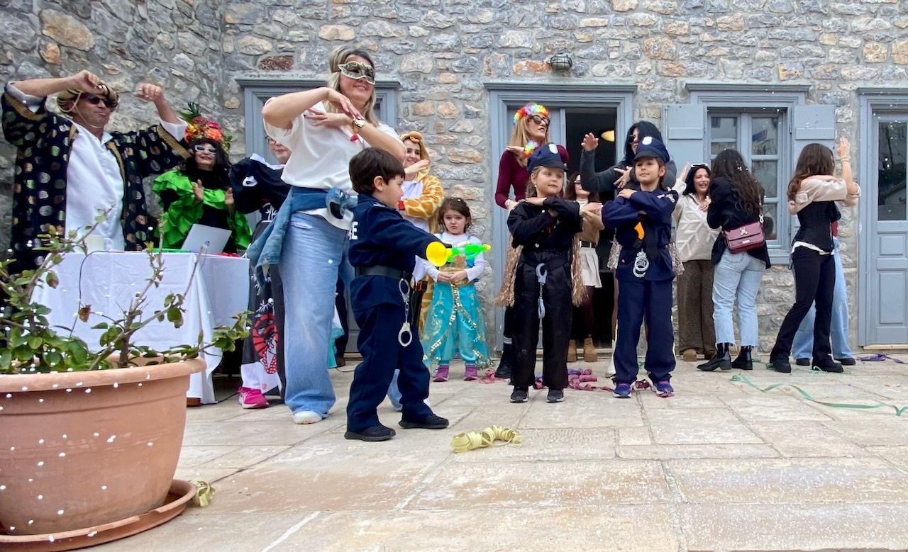 First stop at the Language School on the Carnival Parade Route on Hydra Island Greece 2025