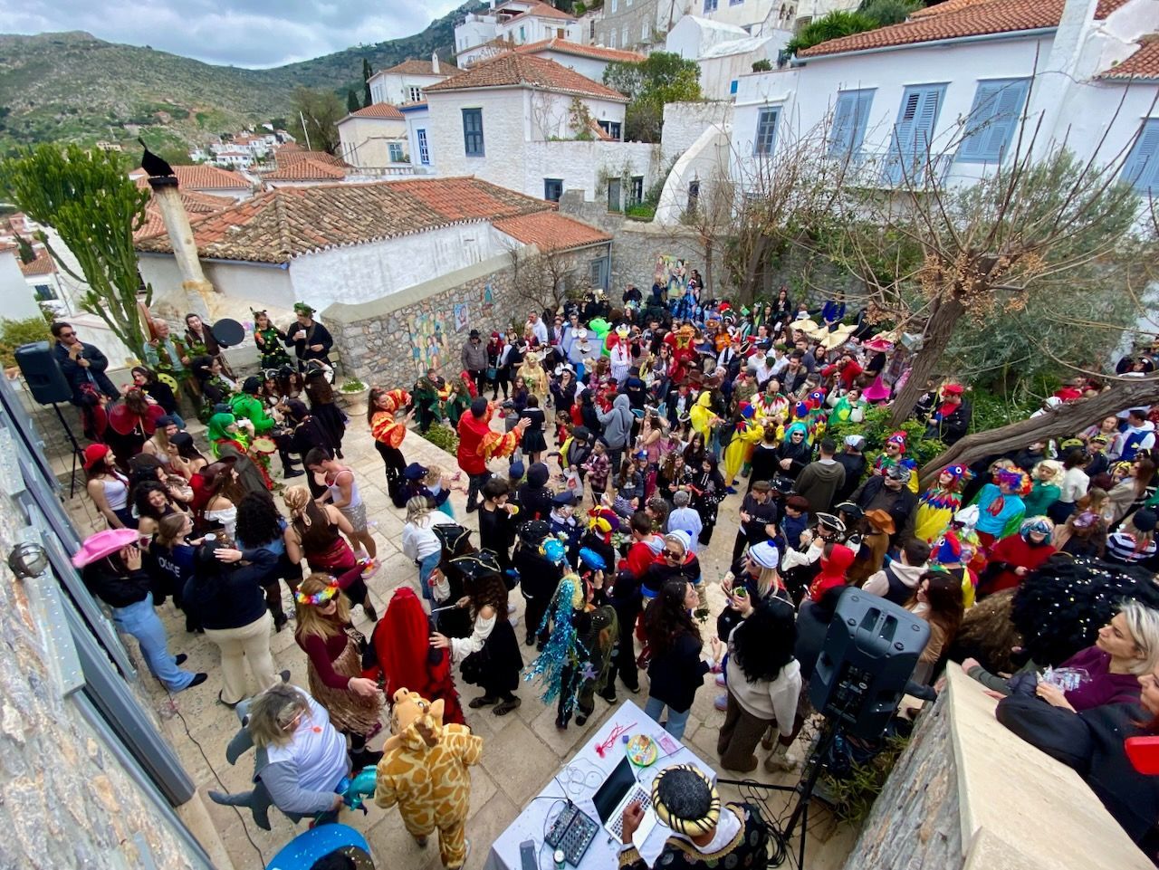 First stop at the Language School on the Carnival Parade Route on Hydra Island Greece 2025