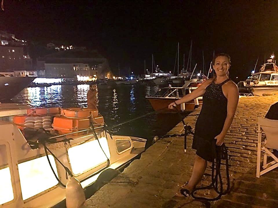 Marina Lazou with her sea taxi for Hydra on board the Eleni Sea Taxi on Hydra Island Greece for all your travel requirements.
