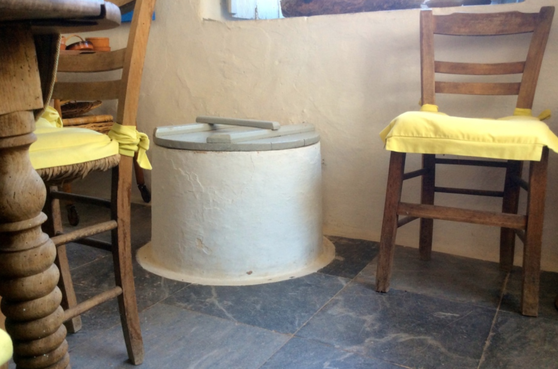 Well head for a freshwater cisterna in a traditional house on Hydra Island Greece.