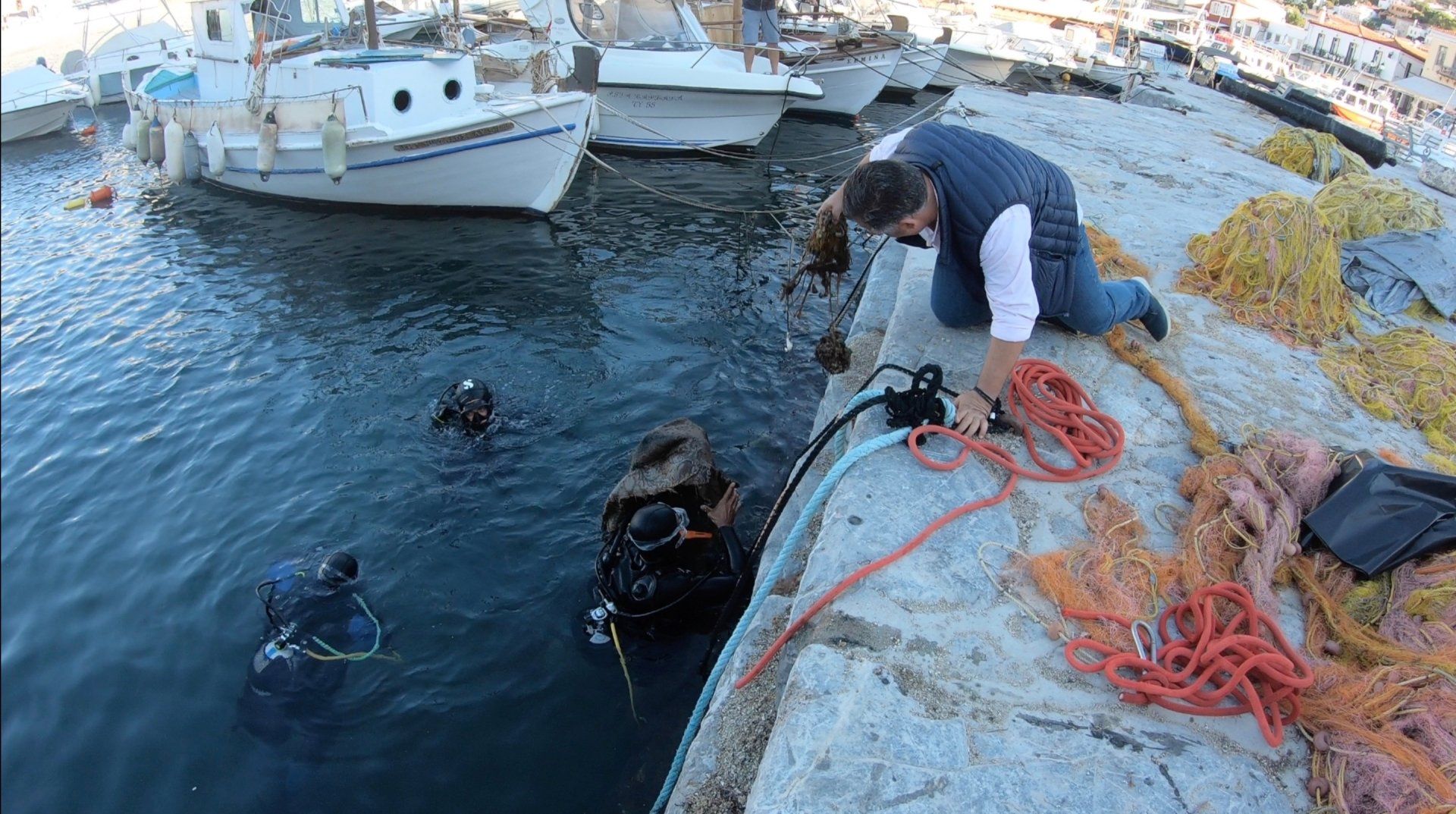 Oct 31 2020 Cleanup operation of seabed rubbish in Hydra Harbour on Hydra Island Greece.