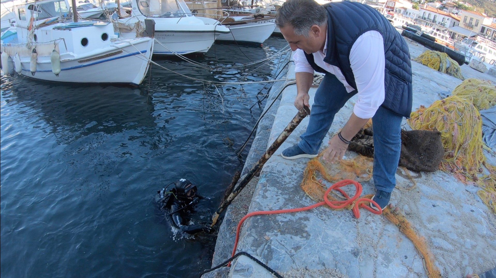 Oct 31 2020 Cleanup operation of seabed rubbish in Hydra Harbour on Hydra Island Greece.