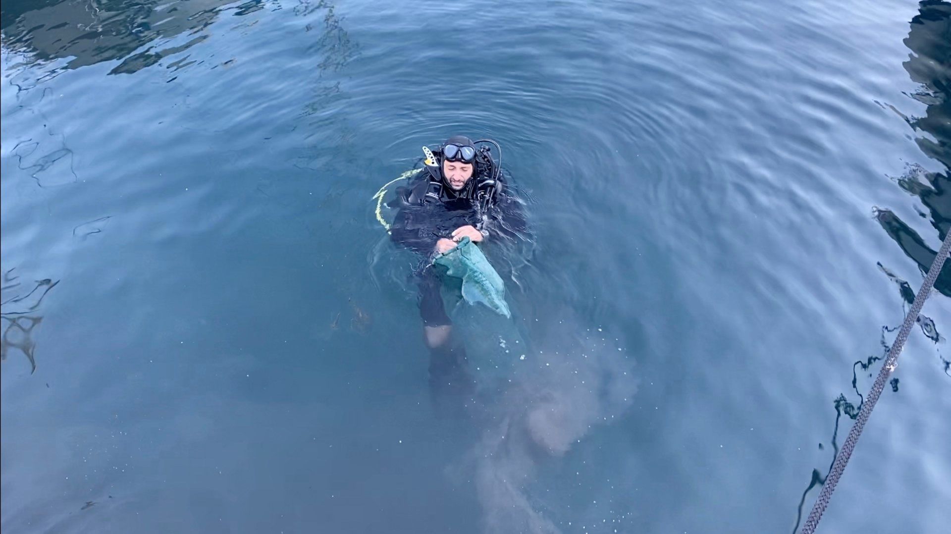 Oct 31 2020 Cleanup operation of seabed rubbish in Hydra Harbour on Hydra Island Greece.