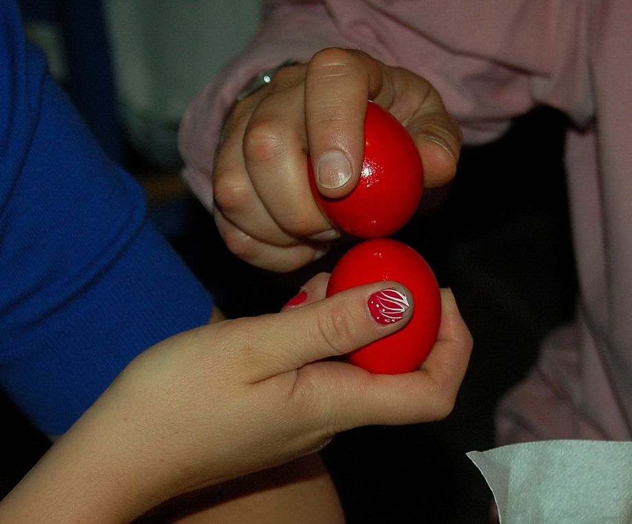 Traditional red egg tapping on Easter Saturday night for Pascha on Hydra Island Greece