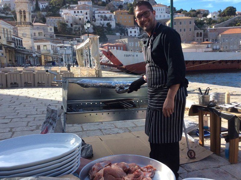 Kosmas Savriadi of Orea Ydra cooking on the grill for Tsiknopempti 8th February 2018 on Hydra Island Greece.