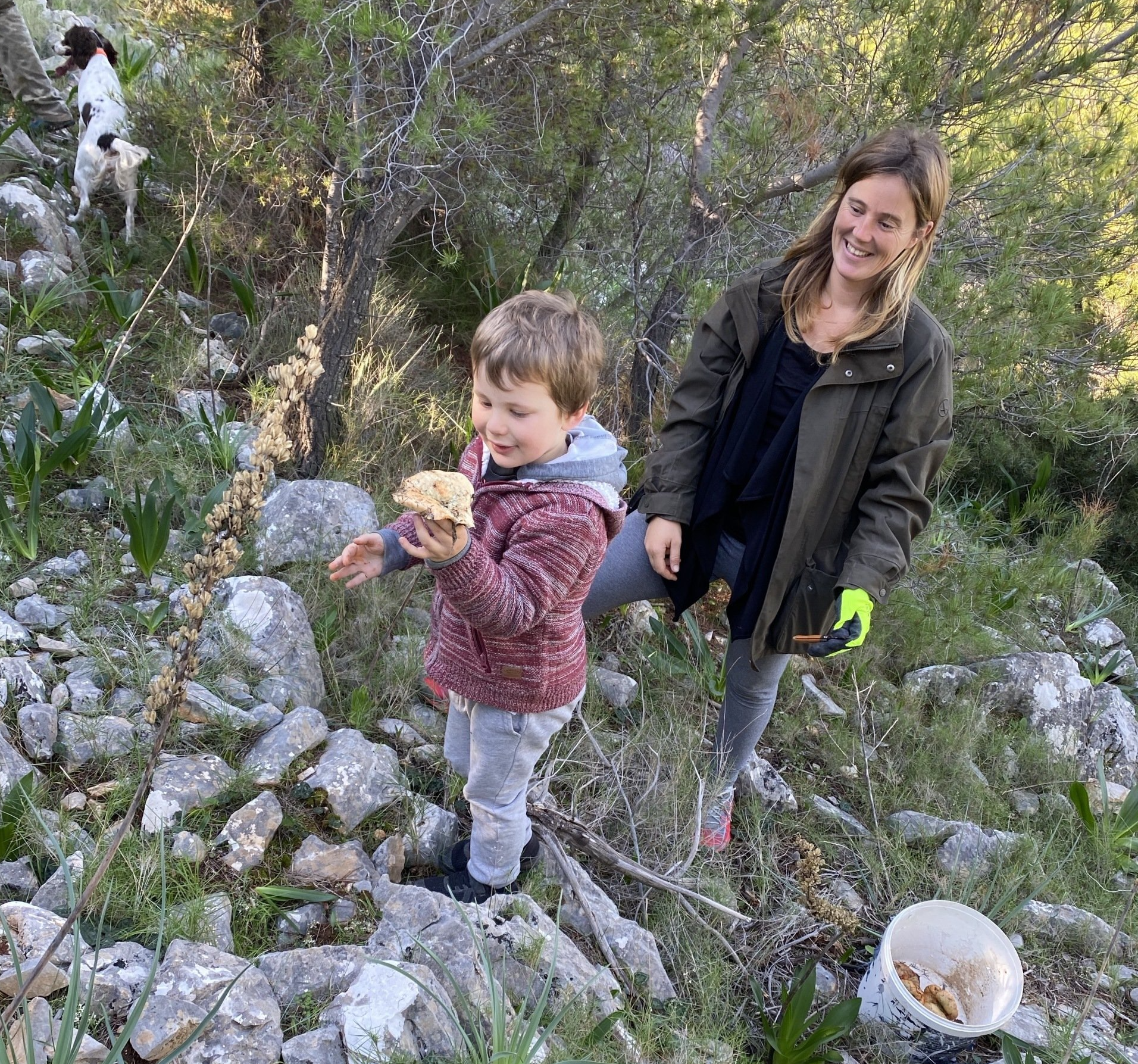 Anastasis and  Harriet mushroom picking on Hydra Island Greece.