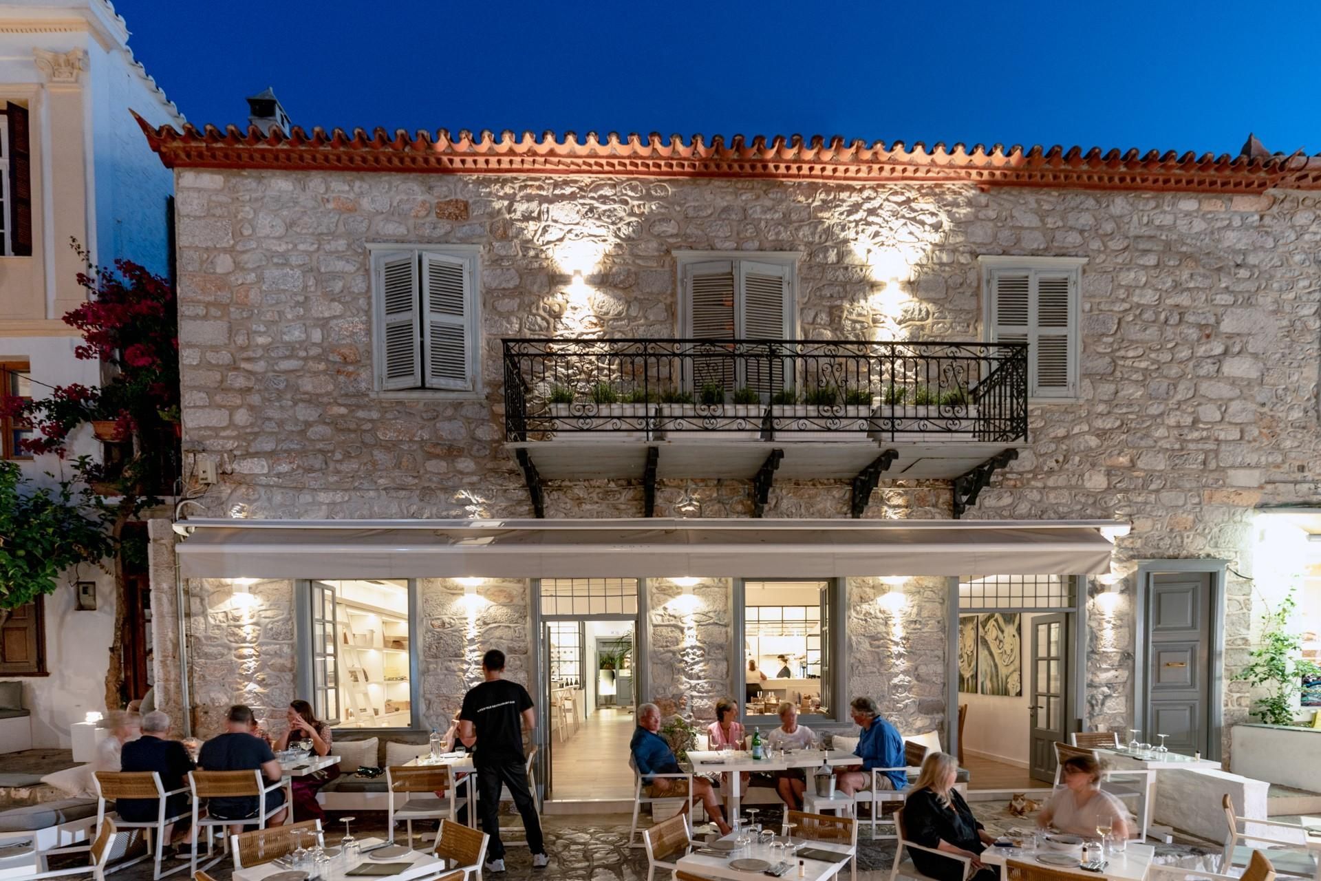 Visit Mikra Agglia Outside the Mikra Agglia Restaurant on Hydra Island Greece