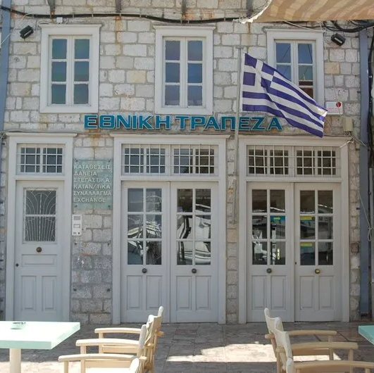 National Bank of Greece on Hydra more or less in the centre of Hydra Harbour. National Bank of Greece on Hydra Island Greece.