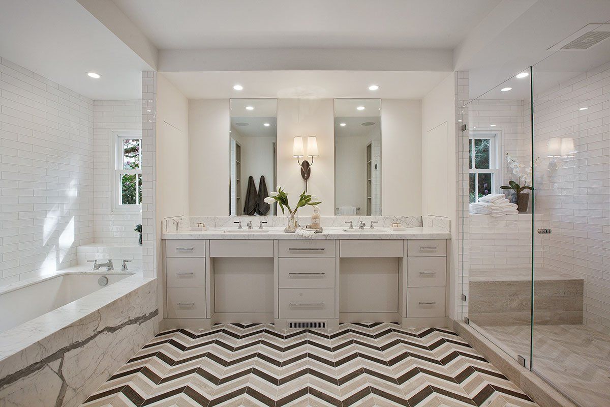 chevron tiles in master bathroom with subway tiles is a timeless classic design