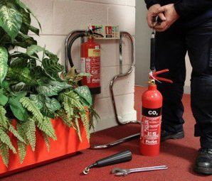 Fire extinguisher annual service being carried out