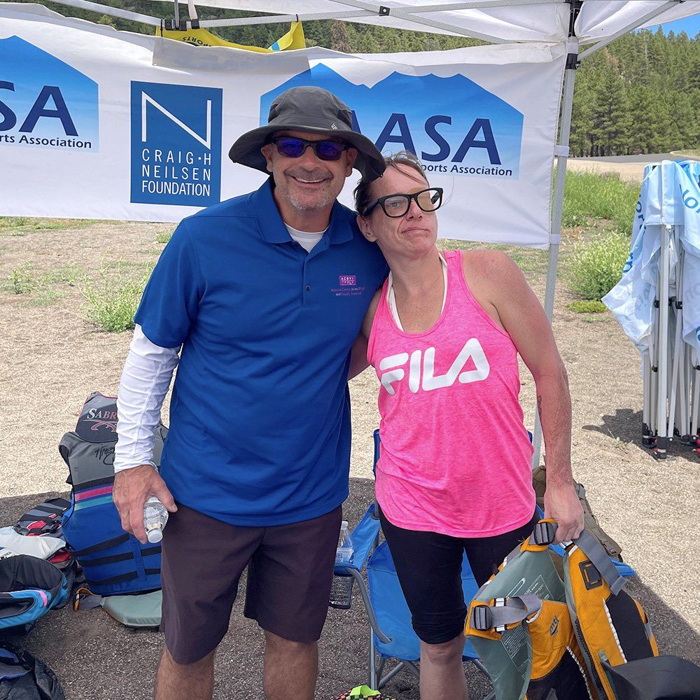 photos of blind man water skiing, man and woman at a waterspouts event, and two men-one blind at a getting ready to ski