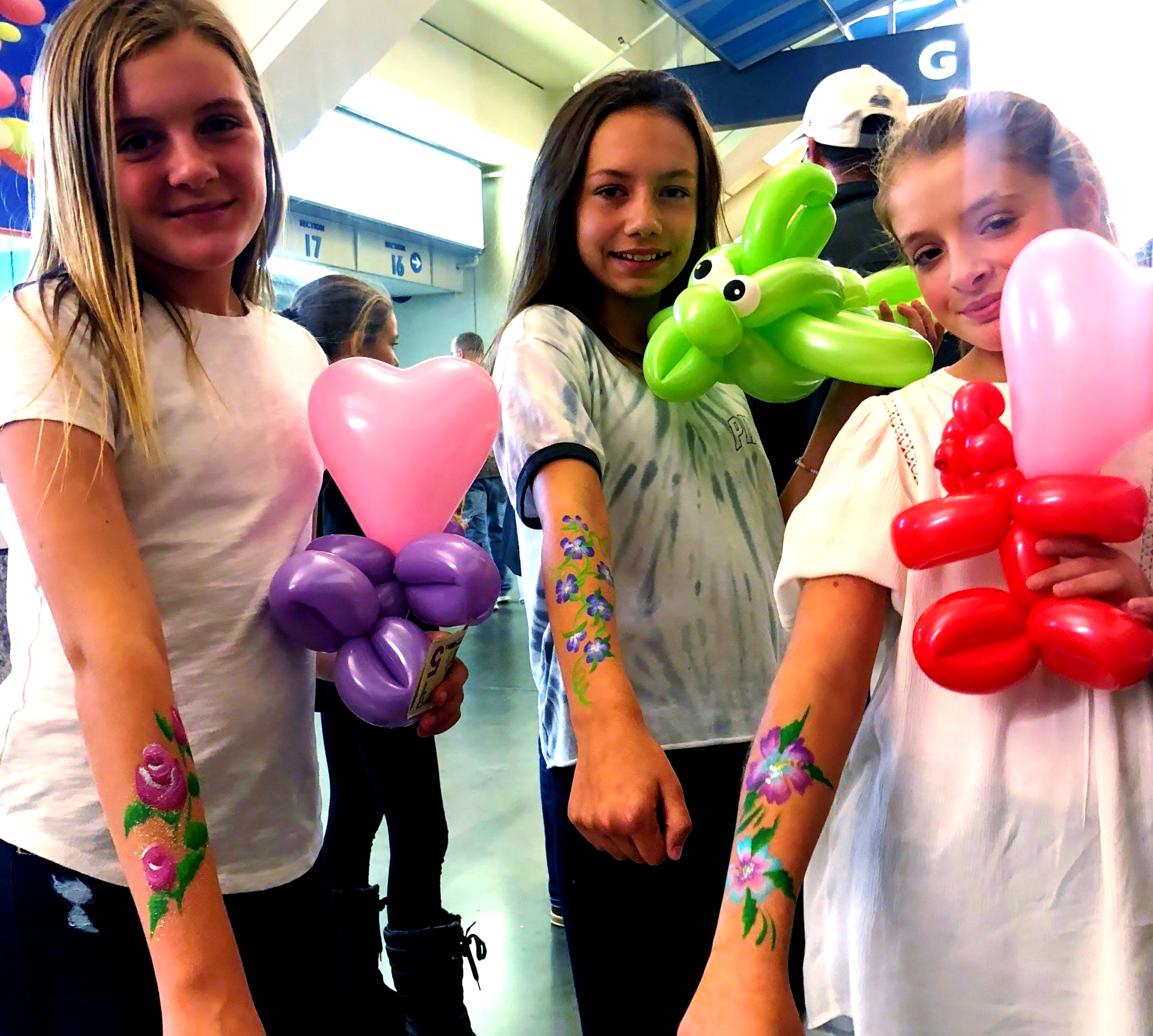 Body art and balloon twisting at fundraiser