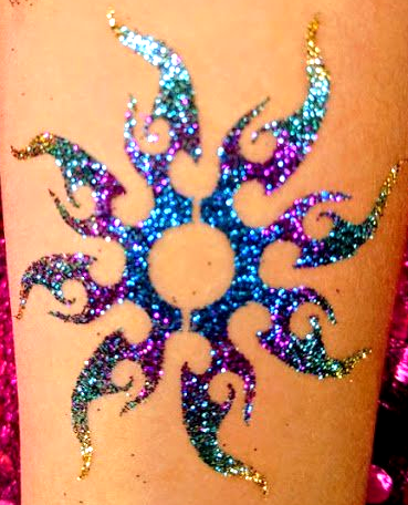 glitter tribal sun tattoo