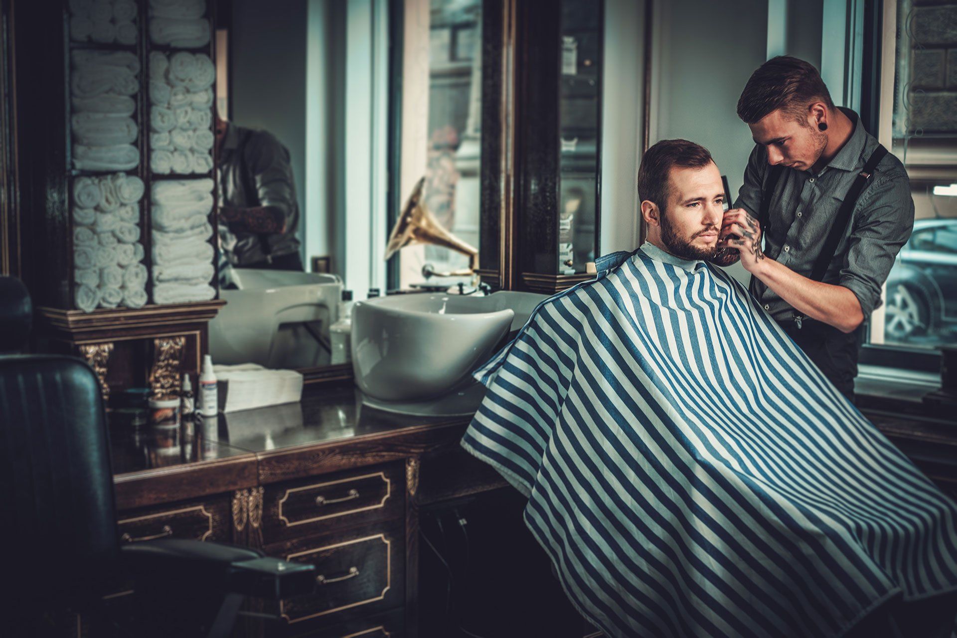 a barber cutting a mans hair