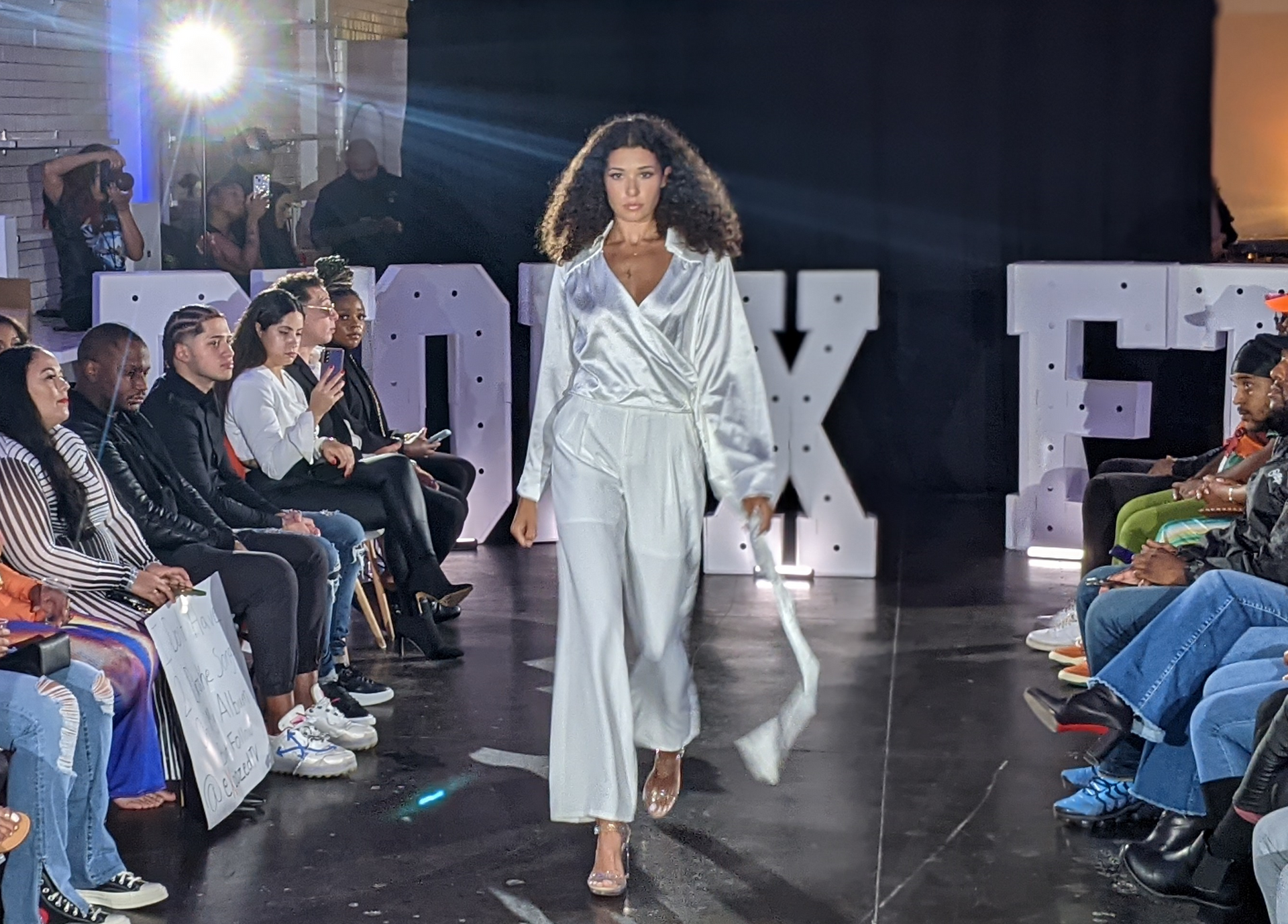 Model in White on Fashion Runway Fall 2023 Lighting Rental and Design by The House Of Jax Model in White on Fashion Runway Fall 2023 Lighting Rental and Design by The House Of Jax