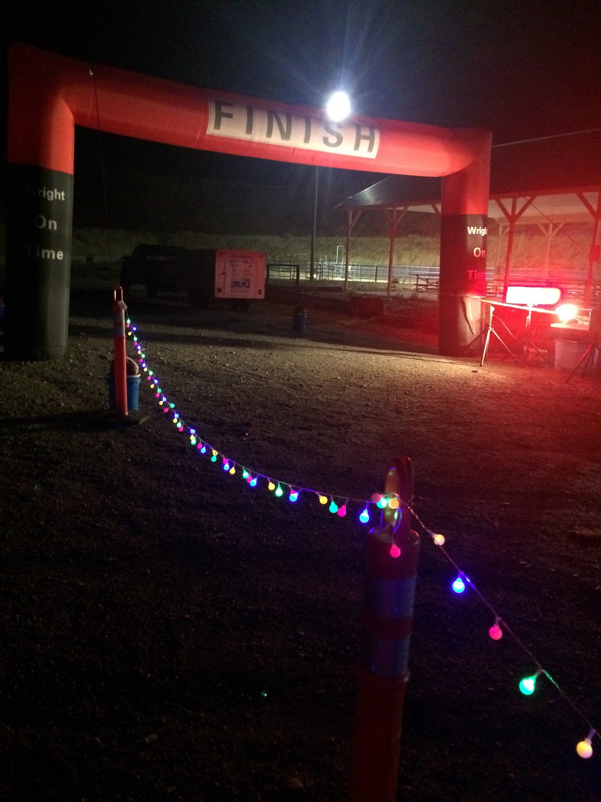 Finish line at night with Christmas lights